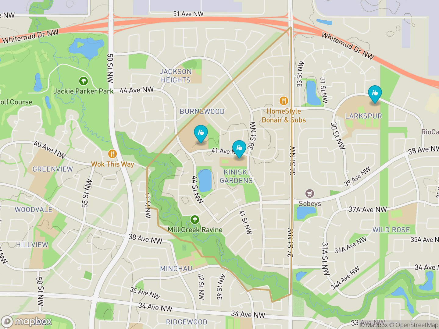 Map of Kiniski Gardens, Edmonton — neighbourhood boundary, 3 schools, parks and surrounding streets.